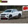 Far View image of the Toyota Hilux Revo with the Red Steel Engine Skid Plate with 8 airflow channels and the TRD logo installed.