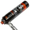 Close-up photo of the reservoir of the Performance Elite Series 2.5 shock absorber, in black, silver, and orange colors, featuring the logo of the manufacturer ''FOX''.
