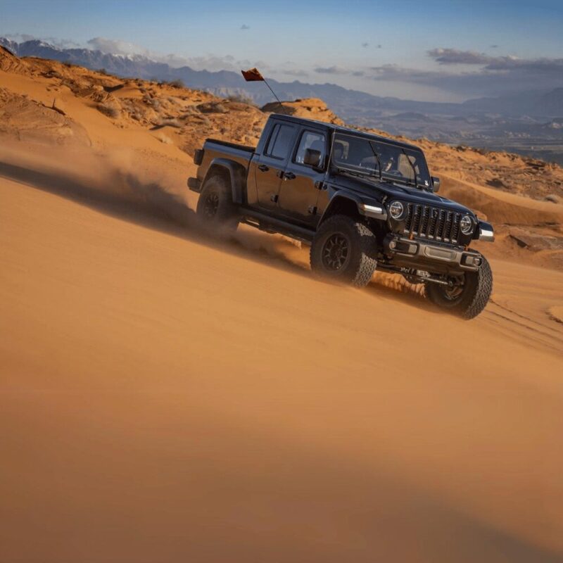A Jeep Gladiator JT driving in a desert.