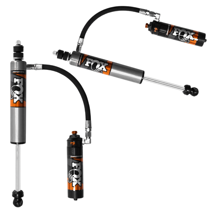 Close-up product photo of the Front FOX Shocks Performance Elite 2.5 Reservoir Adjustable DSC Lift 0-2", in black, silver and orange, and the FOX logo.