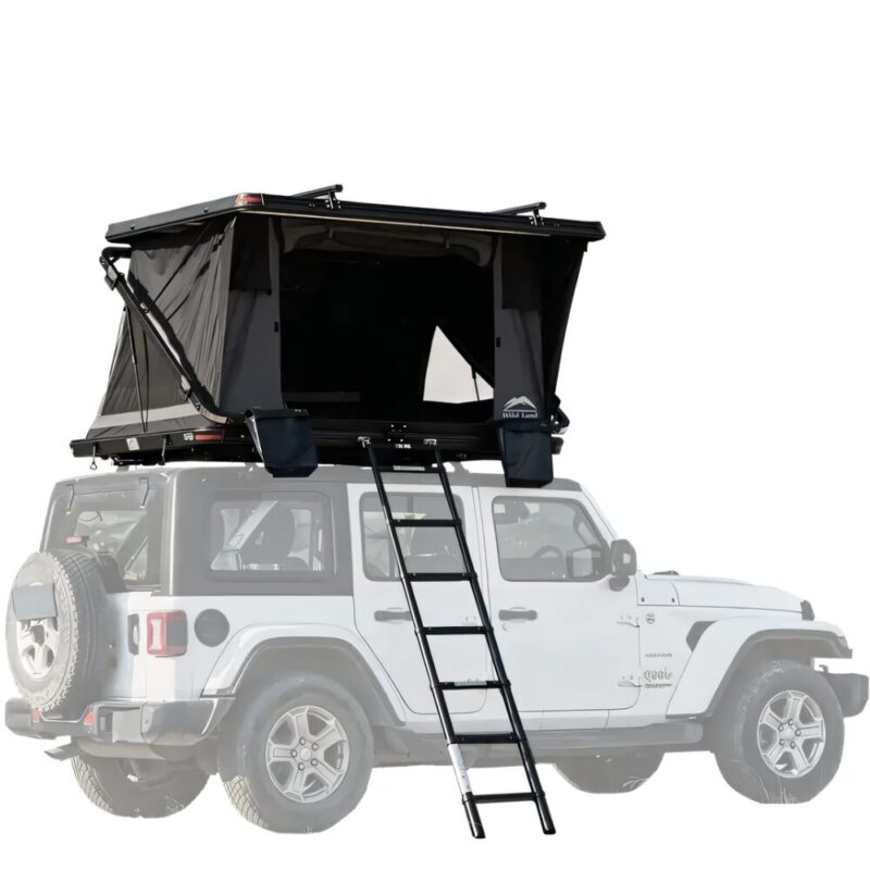 Car Rooftop Tent 2-3 People Rock Cruiser - WildLand: Thumbnail - Product Overview. The roof tent is installed on a jeep wrangler, and stands open with the 2 roof bars of the package installed on the hard shell, and the aluminum telescopic ladder is open and resting on the floor.