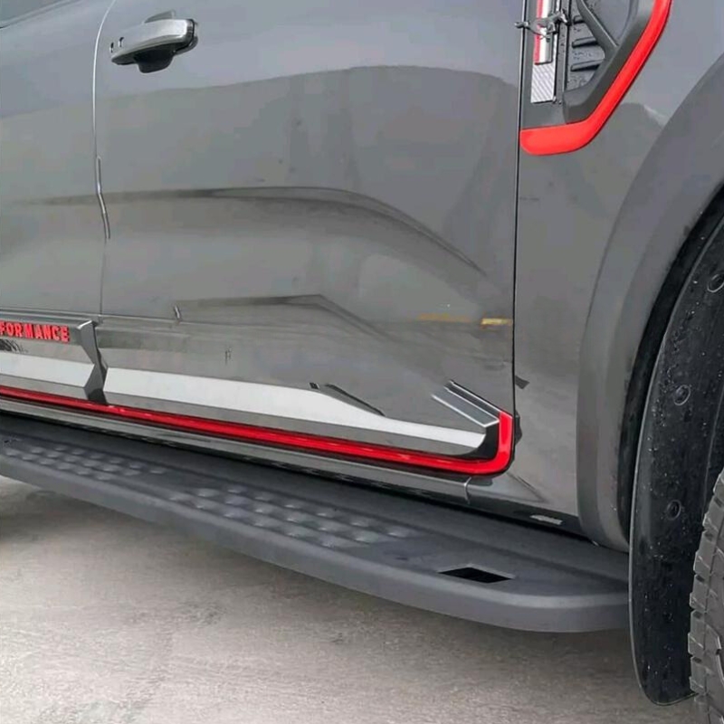 Side close-up image of the Ford Ranger with the Ford Ranger T6-T7-T8 2012-22 Steel Side Steps - Raptor Gen 2 installed.