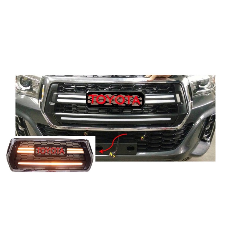 Product and vehicle image showing the Toyota Hilux Rocco 2018-20 Front LED Grille Toyota Logo