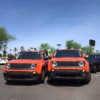 Front view image of two orange Jeep Renegade, one is lifted 40mm while the other is not.
