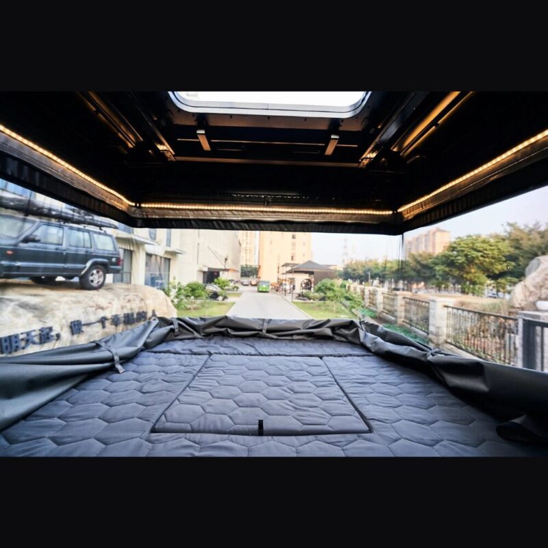 The interior of the second floor of the 4x4 Safari Cruiser roof top tent with the single-piece mesh window open. Perfect 360-degree view.