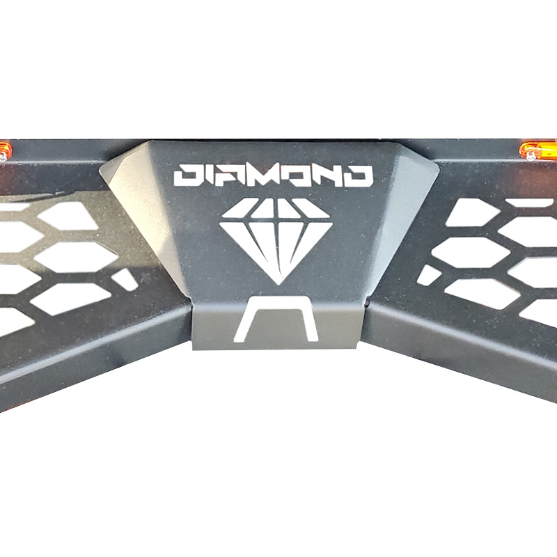 A photo of the Steel Side Steps focusing on the ''Diamond'' logo in the center.