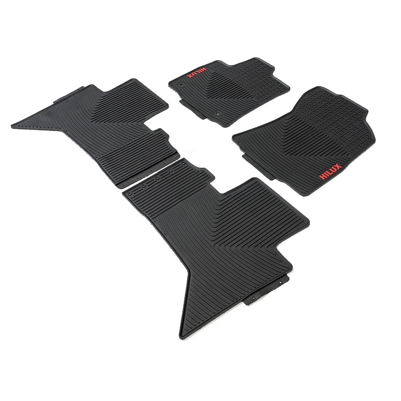 OEM rubber floor mats with the Hilux logo in red for Toyota Hilux Package