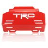 Product display photo of the red Toyota Hilux Revo Steel Engine Skid Plate with 8 airflow channels and the TRD logo.