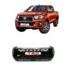 Product and vehicle image showing the Toyota Hilux Rocco 2018-20 Front Grille TRD Type 1