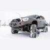 Toyota Hilux Vigo 2005-15 equipped with Front Adjustable FOX Shocks, performing in snowy conditions.