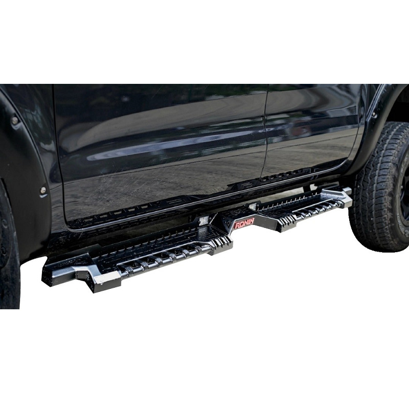 Side close-up image of a pickup truck with the Steel Side Steps - Ronin installed.