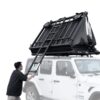 Product demonstration photo of opening and usage: Car Rooftop Tent 4-6 People Wild Cruiser 250 - WildLand. We connect the ladder with hooks on the rooftop tent and pull back to extend.