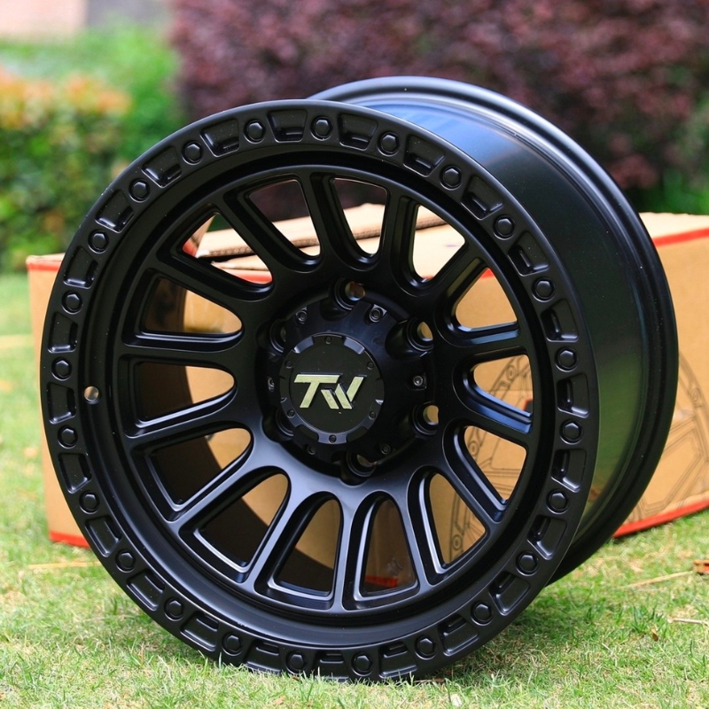 Front view of TW Wheels T22 Rotor Full Black displayed on grass
