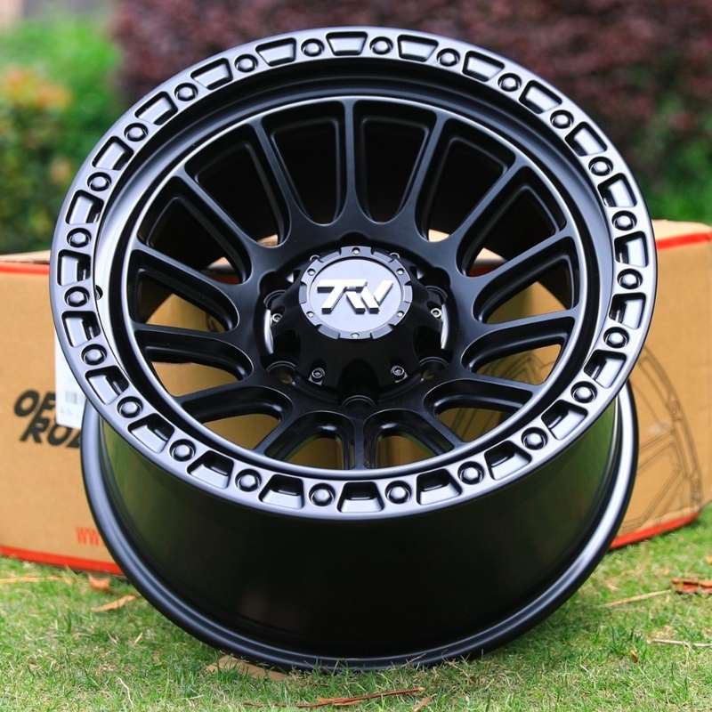 Top view of TW Wheels T22 Rotor Full Black displayed on grass