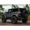 Image displaying the rear view of a vehicle equipped with the Aluminum Wheels 17″ Fuel Off Road Covert [Black]