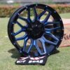 Front view of TW Wheels T3 Lotus Candy Blue displayed on grass
