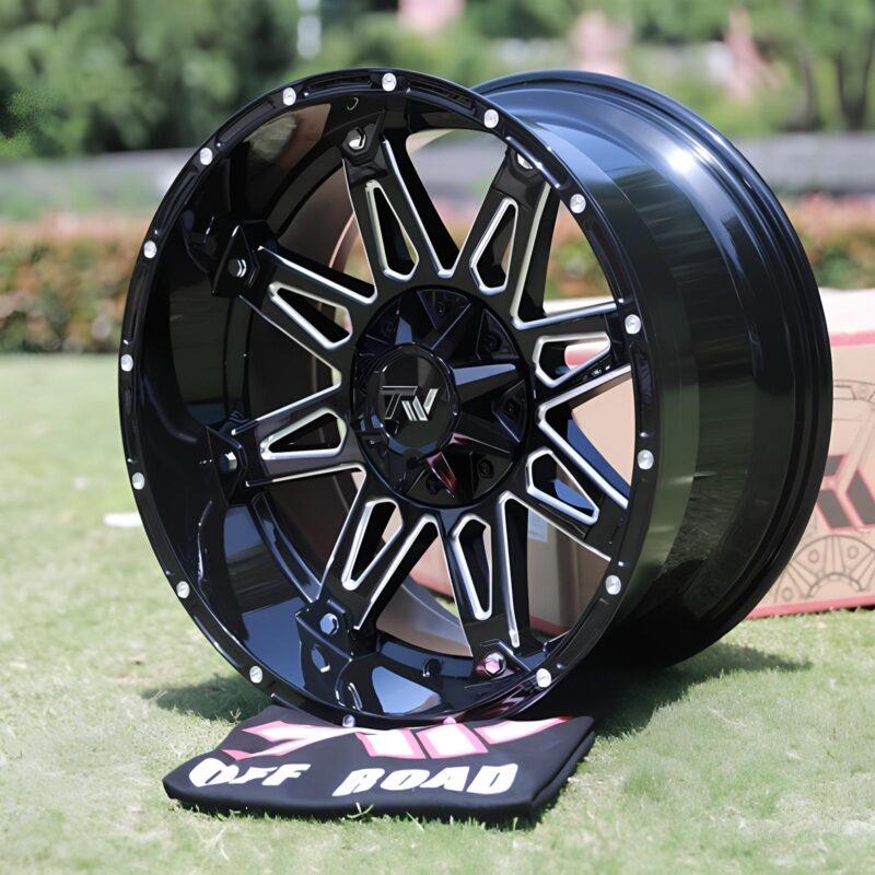 Side view of TW Wheels T1 Spear Silver displayed on grass