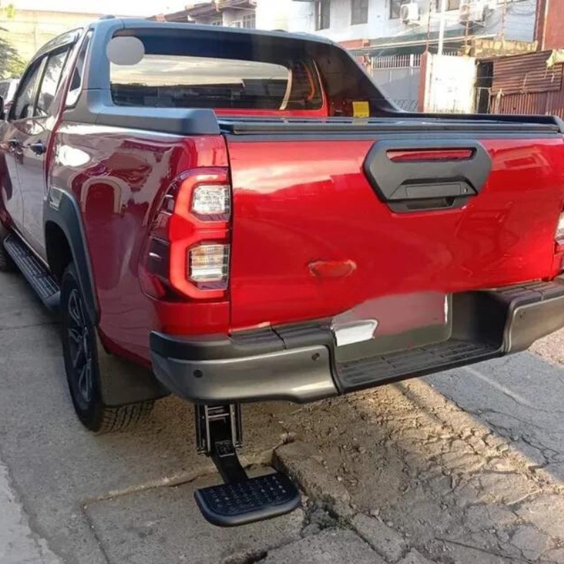 Image showing the Toyota Hilux 2015+ Retractable Rear Bumper Steel Step installed.