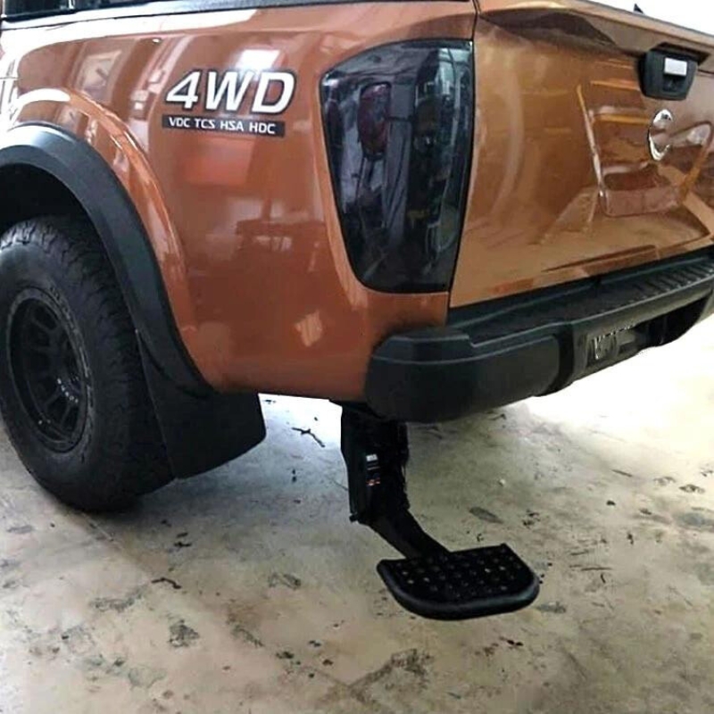 Left side view image of a pickup truck with the Toyota Hilux 2015+ Retractable Rear Bumper Steel Step installed.