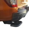 Side close-up image of a pickup truck with the Toyota Hilux 2015+ Retractable Rear Bumper Steel Step installed.